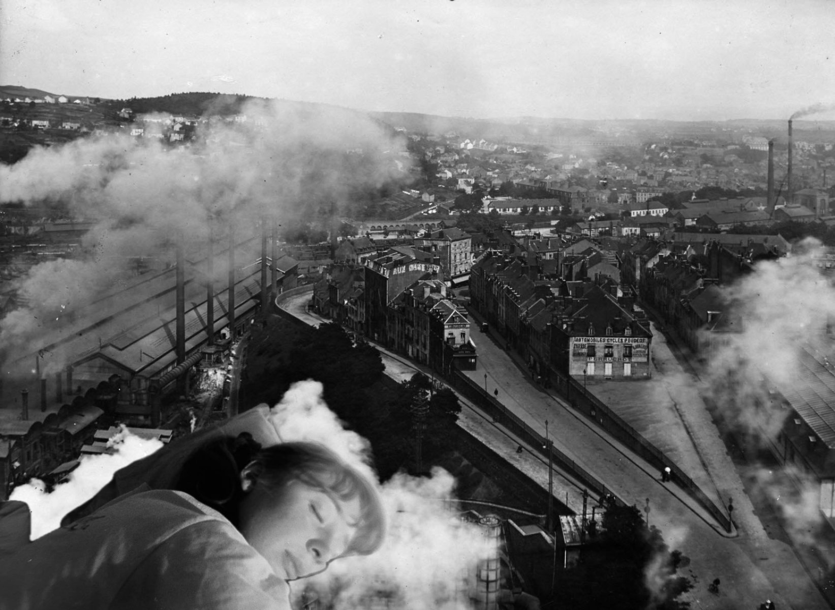 Black and white collage, in the foreground a woman asleep with her head resting on a cloud/smoke, underneath a cityscape.