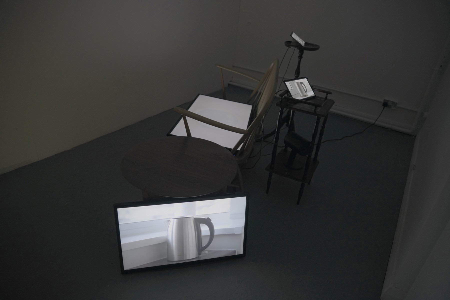 Multi-screens, wooden furniture, video installation