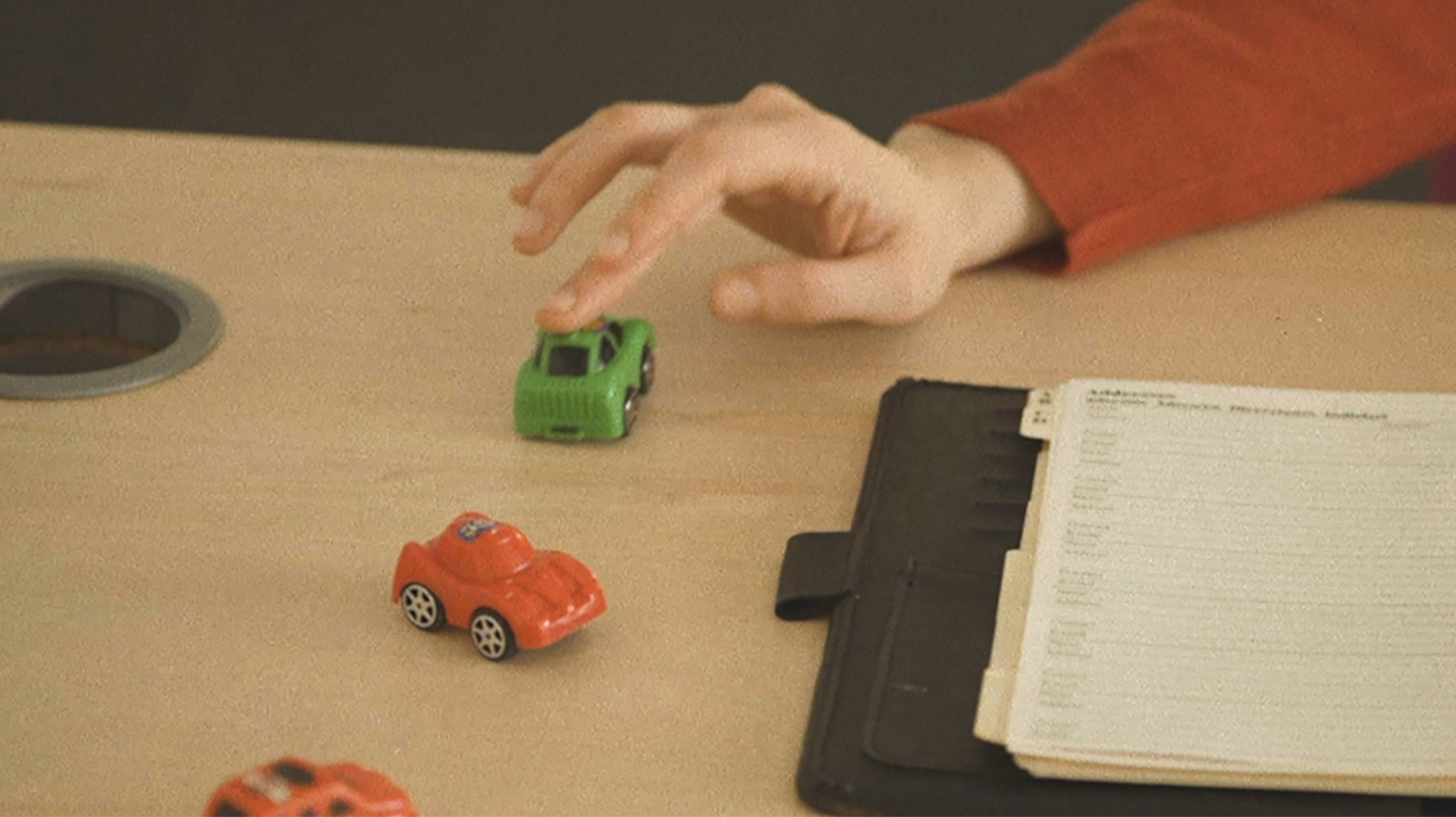 Film still, toy cars and filofax