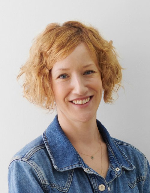 Head and shoulders photograph of Rose Davey smiling.